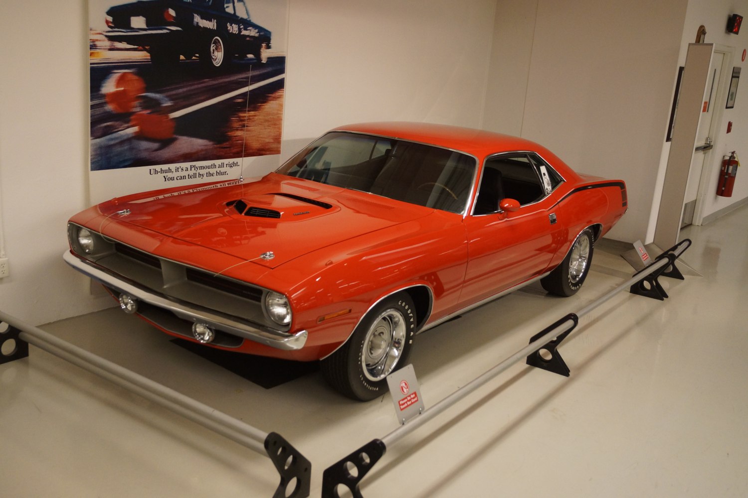 Red muscle car with hood scoop and chrome details