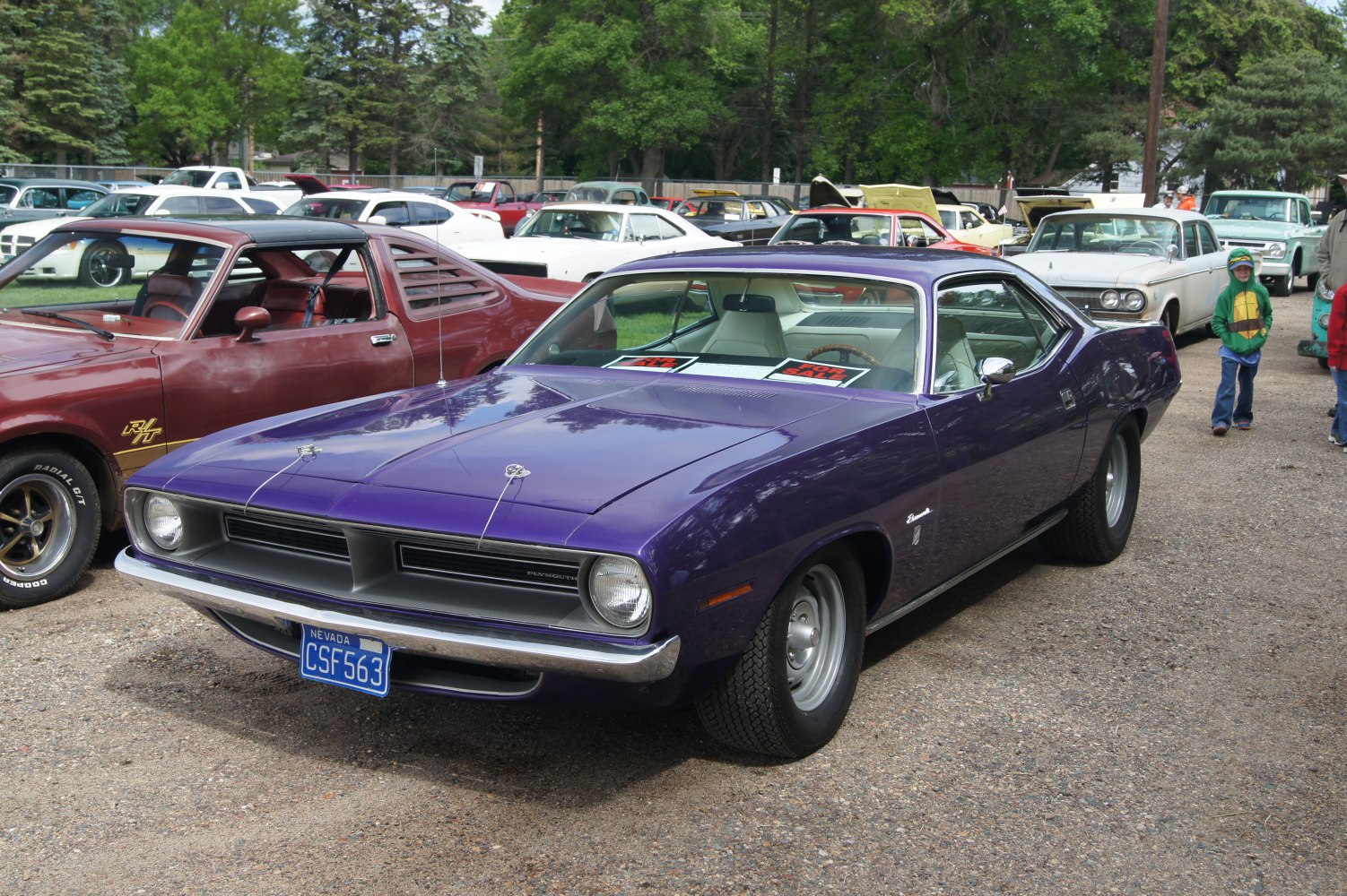 Vintage purple fastback with distinctive grille and muscle car styling