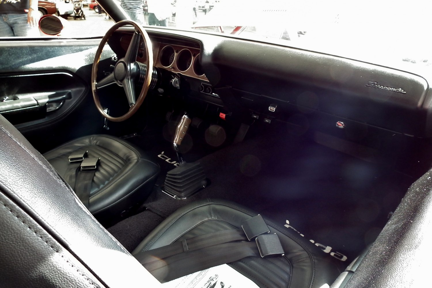 Vintage dashboard, steering wheel, and leather seats interior