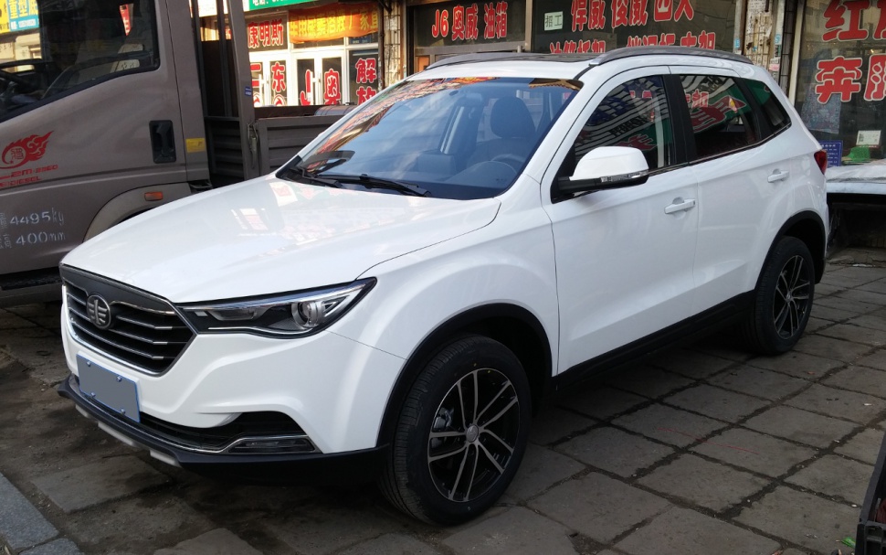 White compact SUV with sleek headlights and black alloy wheels