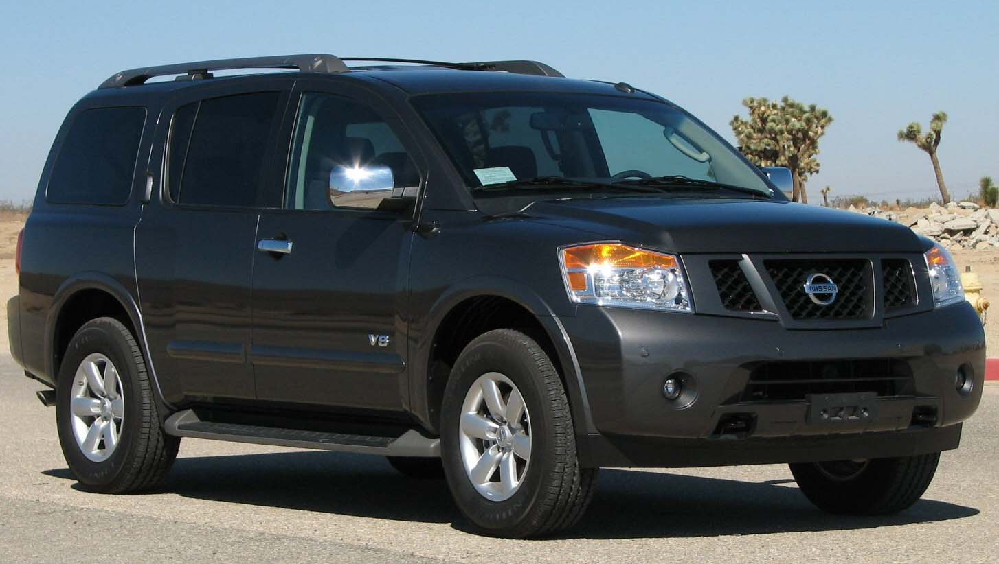 Front side view of large SUV with V8 badge and roof rails