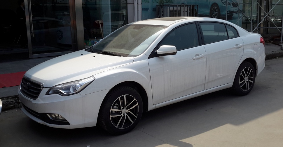 White sedan with sharp headlights and sporty alloy wheels