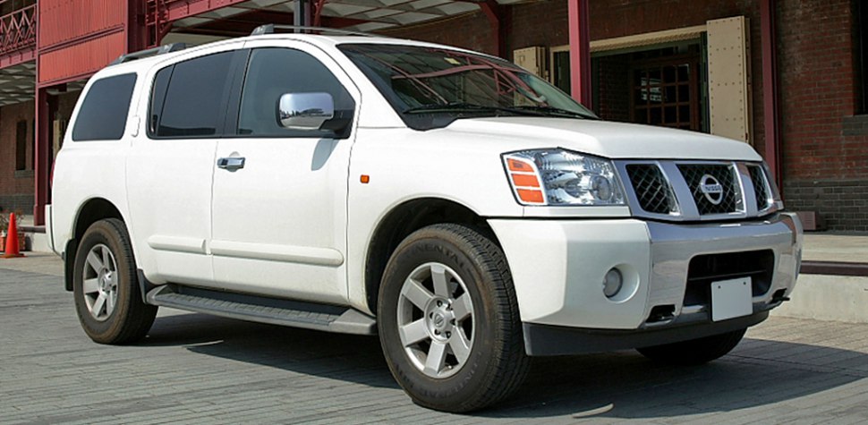 White full-size SUV front side view with alloy wheels