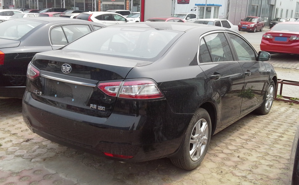 Rear and side sedan exterior with taillights and alloy wheels