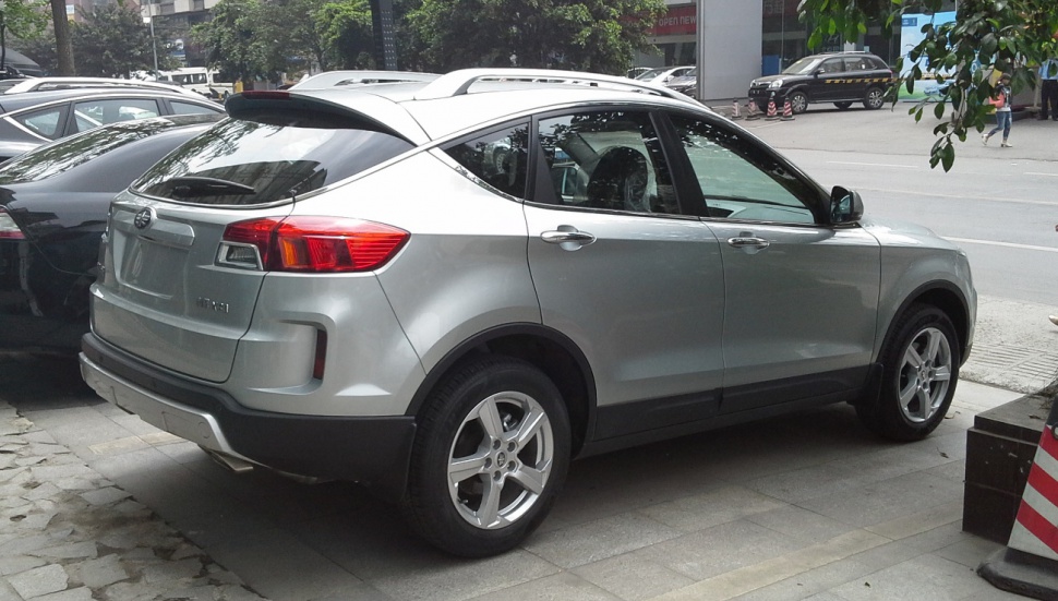 Silver SUV rear side with distinctive taillights and alloy wheels