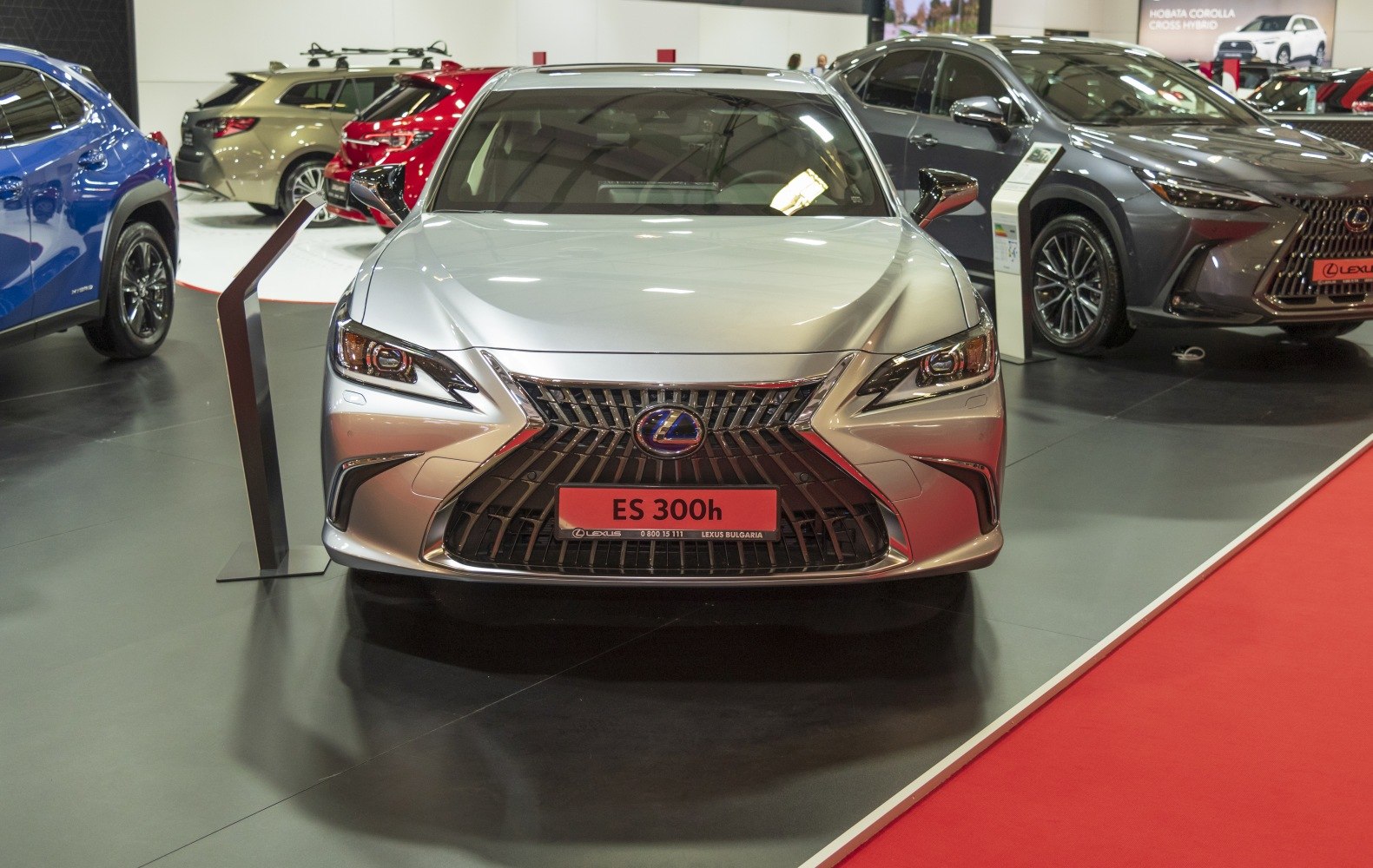 Front view of a luxury sedan showing distinctive spindle grille and sharp LED headlights