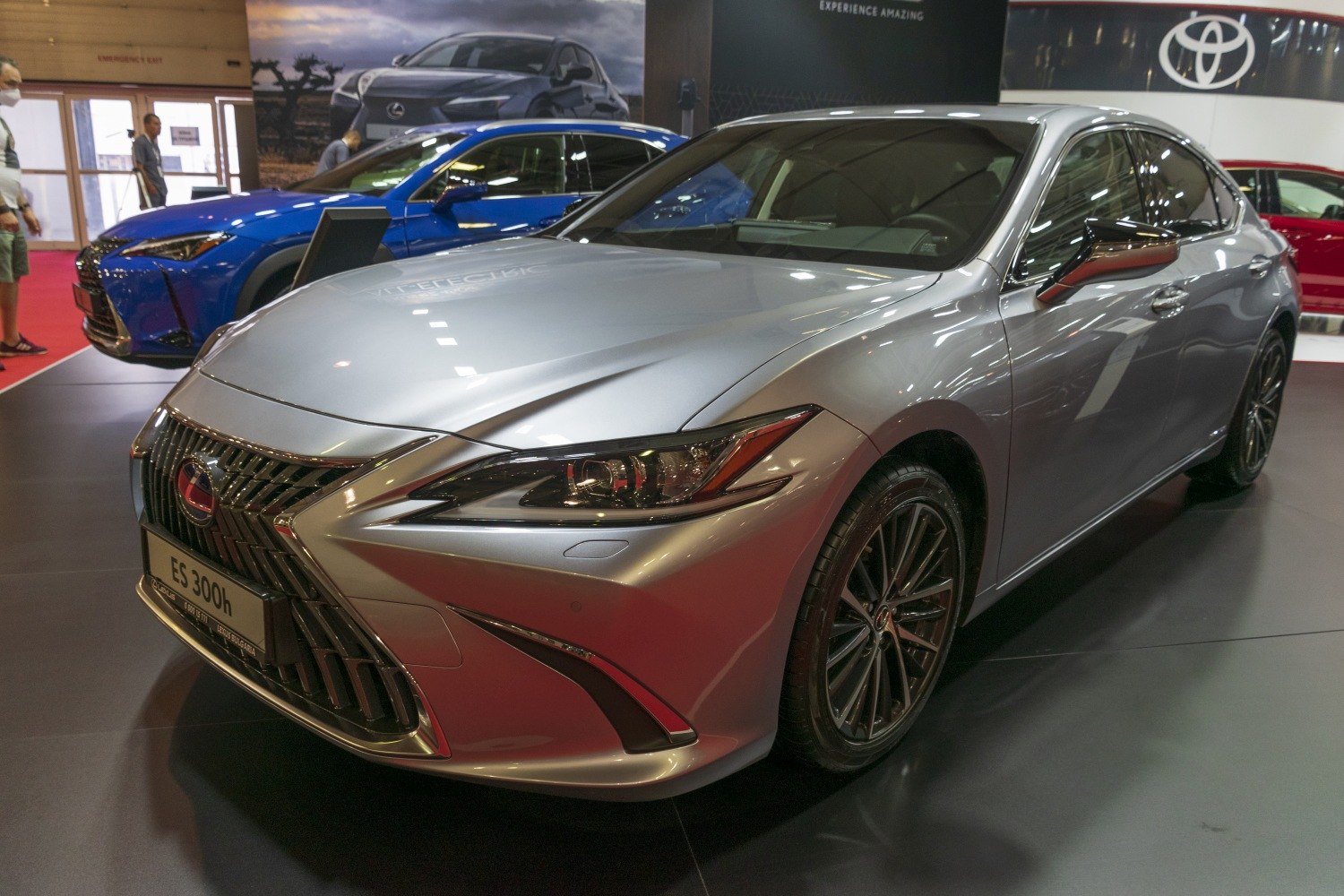 Front view of modern sedan featuring bold spindle grille and sharp LED headlights.
