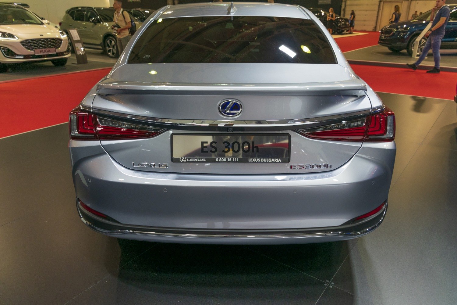Rear view with distinct taillights and trunk spoiler