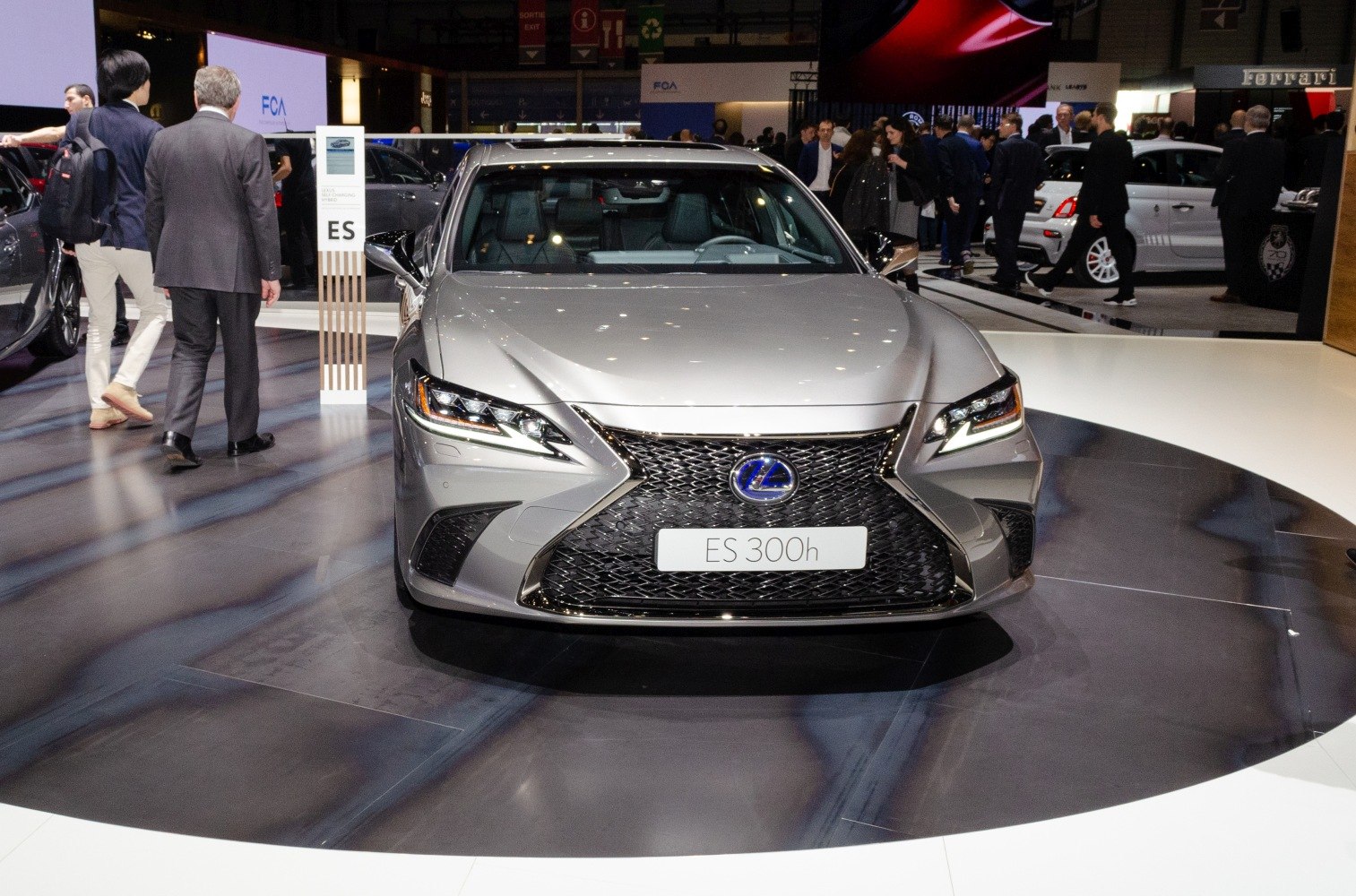 Sharp LED headlights and signature spindle grille on a modern luxury sedan front.
