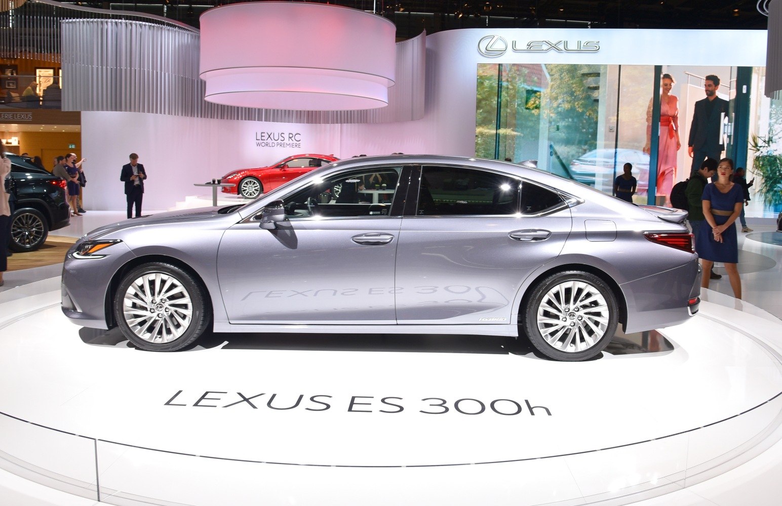 Side view of a silver sedan with alloy wheels and aerodynamic design