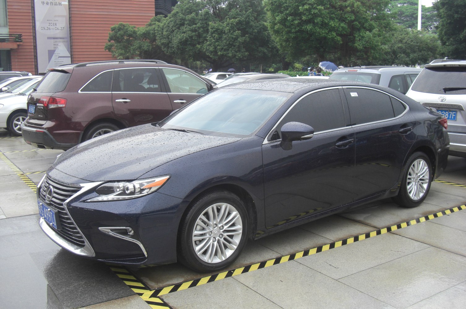 Sleek luxury sedan front side view with LED headlights and alloy wheels