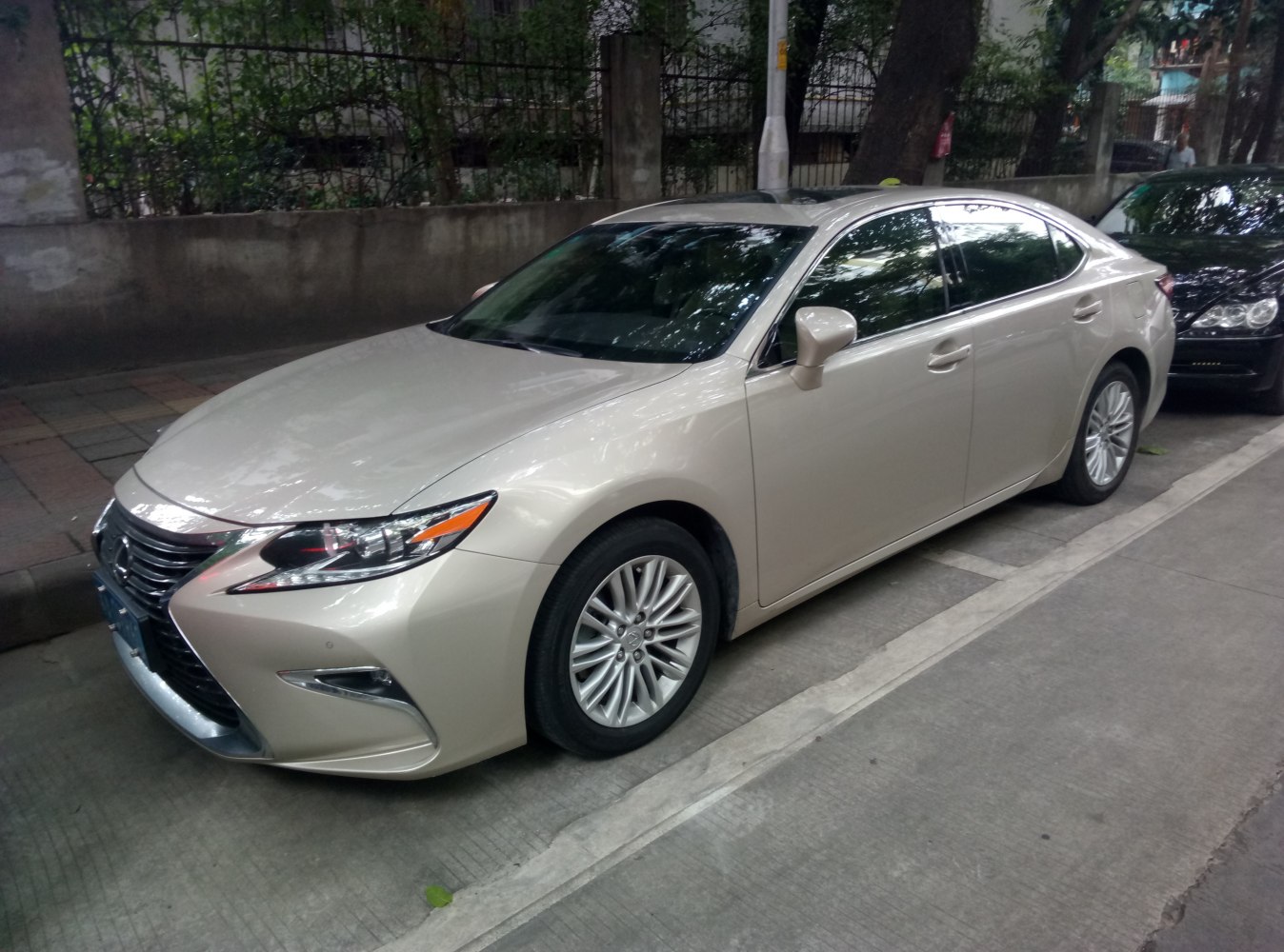 Front side profile and alloy wheels of sedan