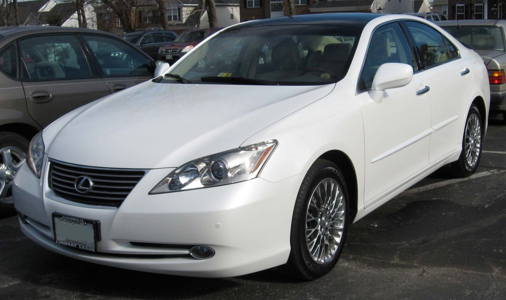 Front and side view of sedan with alloy wheels and sleek headlights