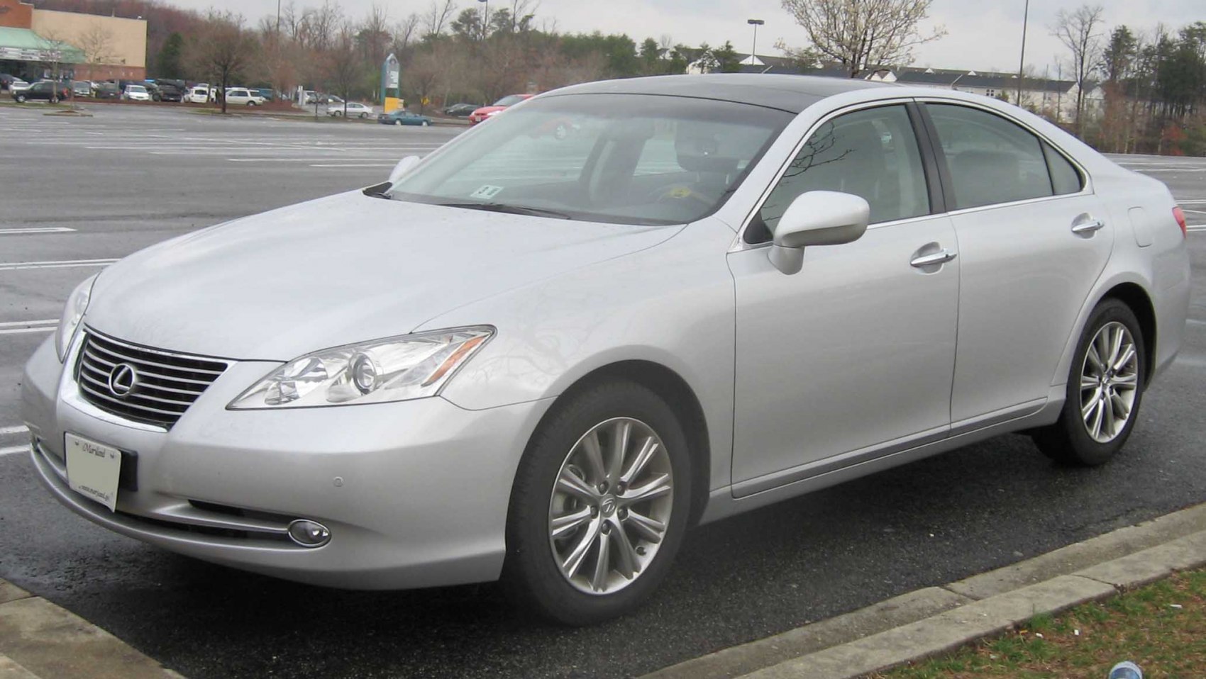 Silver sedan front-side view with alloy wheels and sleek design