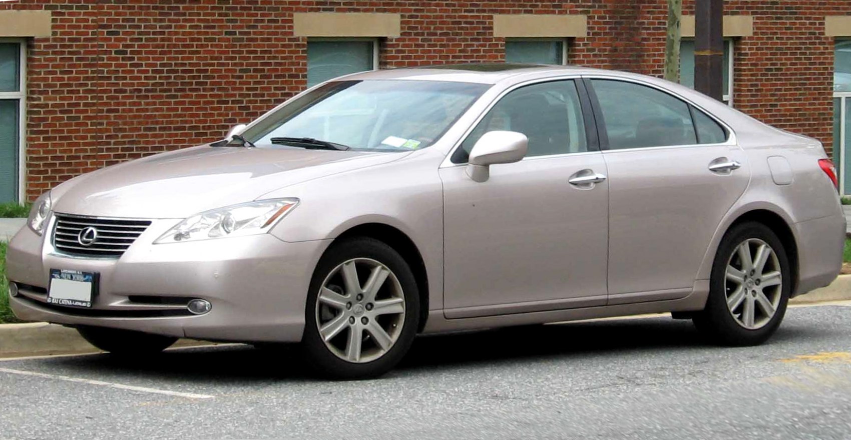 Front-side view sedan with sharp headlights and alloy wheels