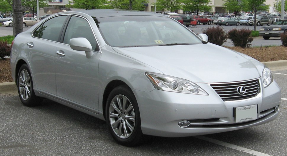 Silver sedan showcasing front and side exterior features in parking lot