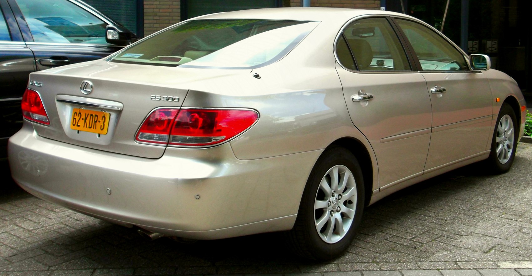 Rear and side view with distinctive tail lights and smooth sedan body lines