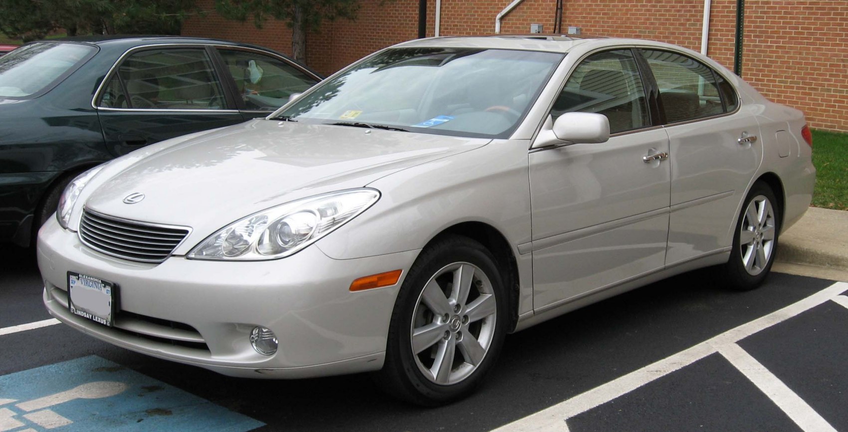 Front and side profile of silver luxury sedan with alloy wheels