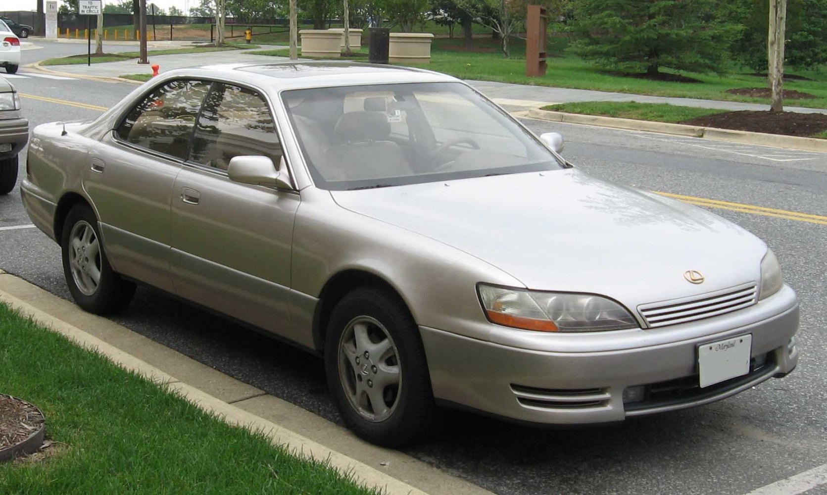 Front three-quarter view of a 1990s luxury sedan with classic design.