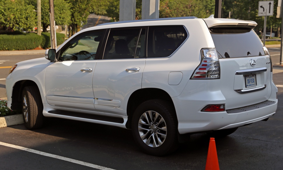 Side and rear view of a white SUV with chrome accents and distinctive taillights