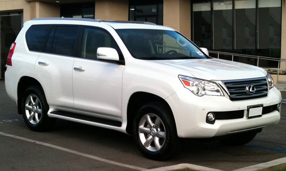 White SUV with chrome grille and alloy wheels, viewed from side-front angle