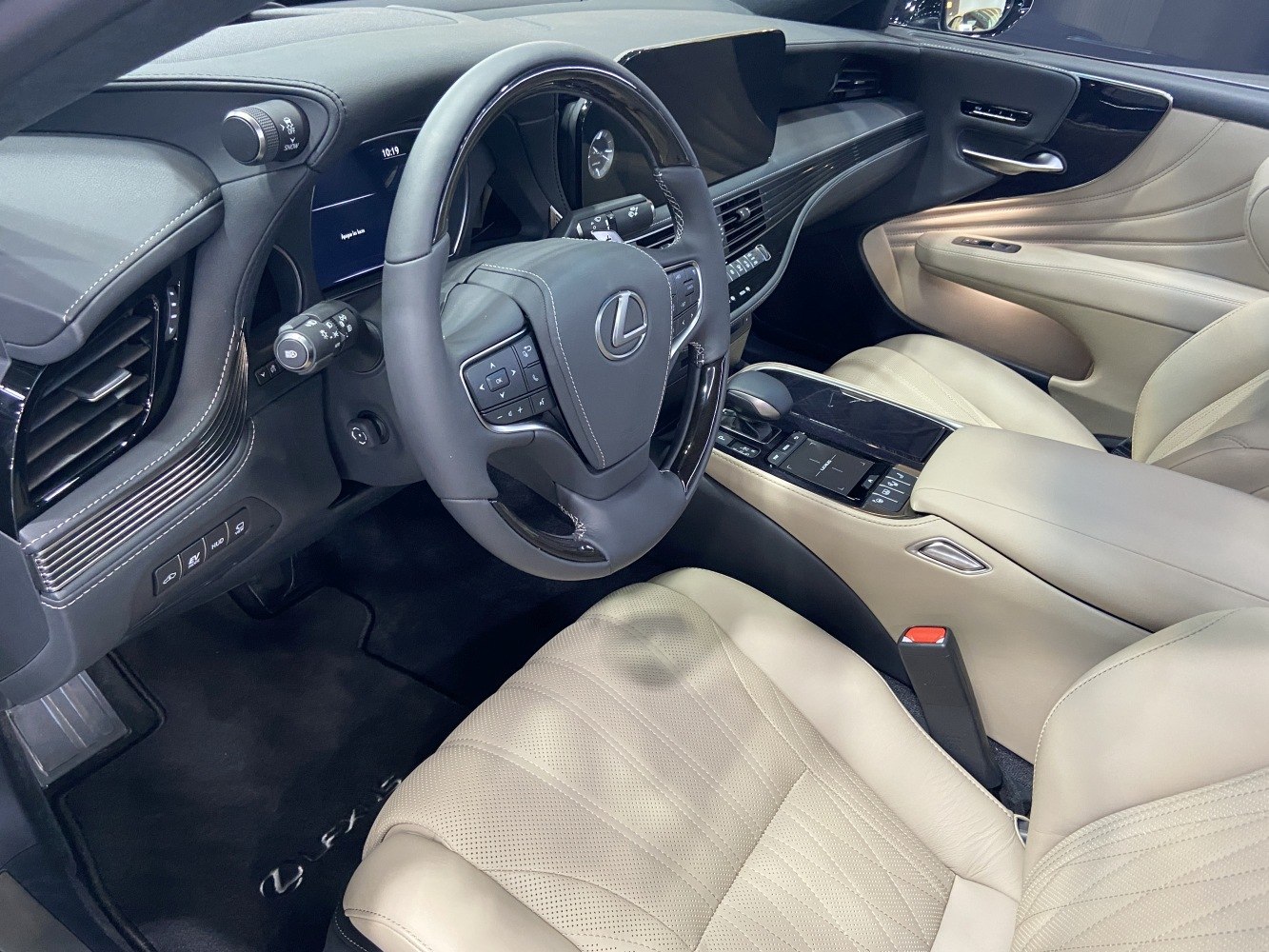 Luxury car interior with leather seats and modern steering wheel