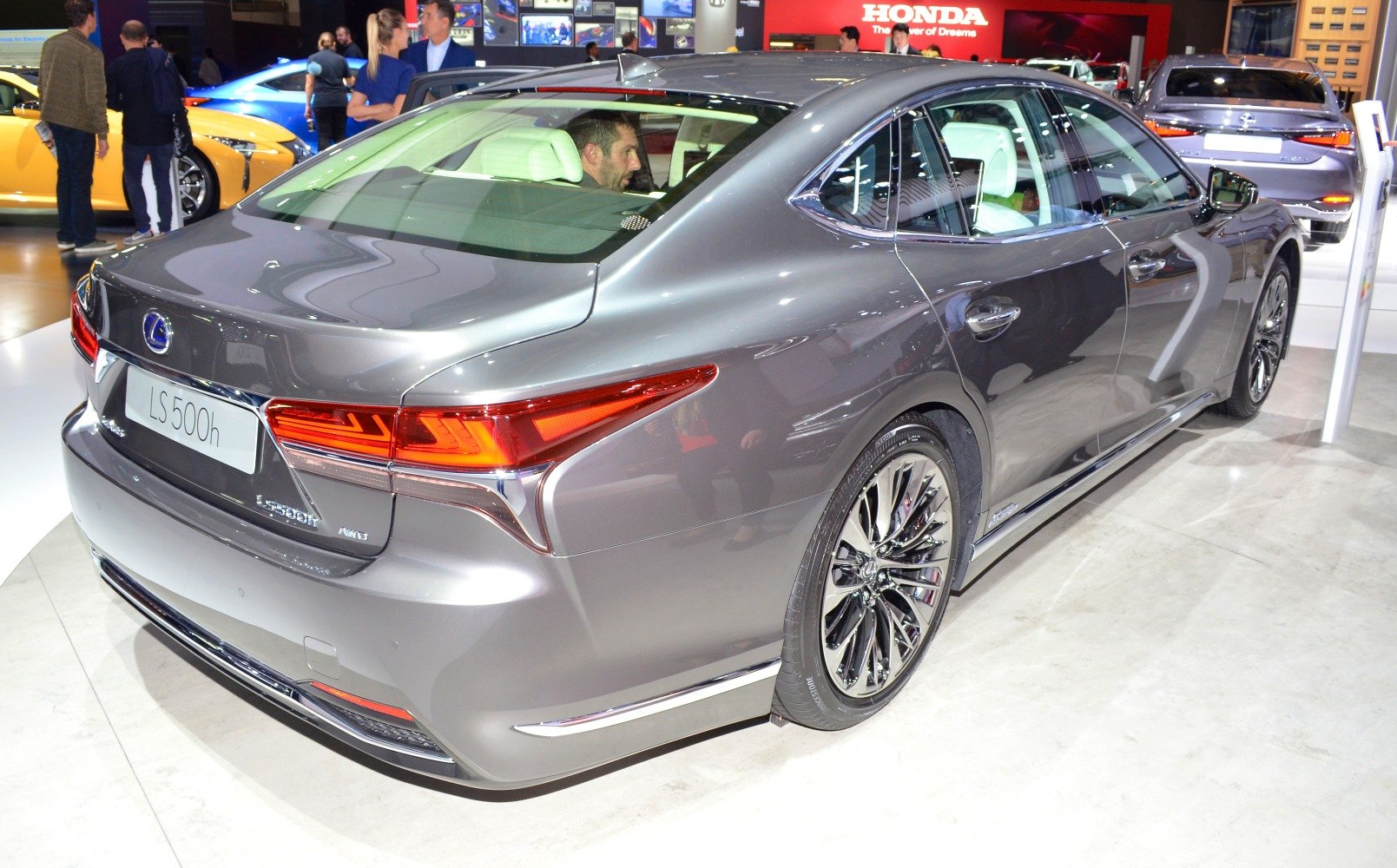 Luxurious sedan rear design with LED taillights and multi-spoke alloy wheels