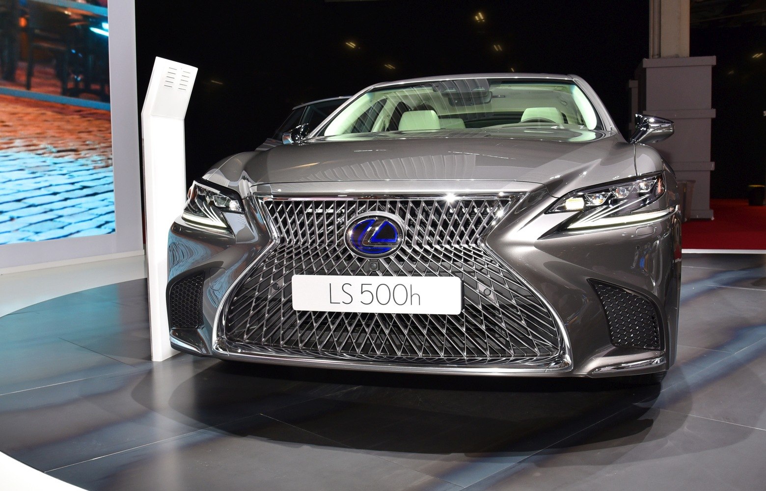 Bold front grille and sleek LED headlights of a luxury sedan