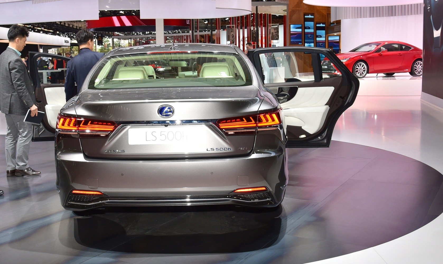 Rear view with LED taillights and open rear door showcasing luxury interior