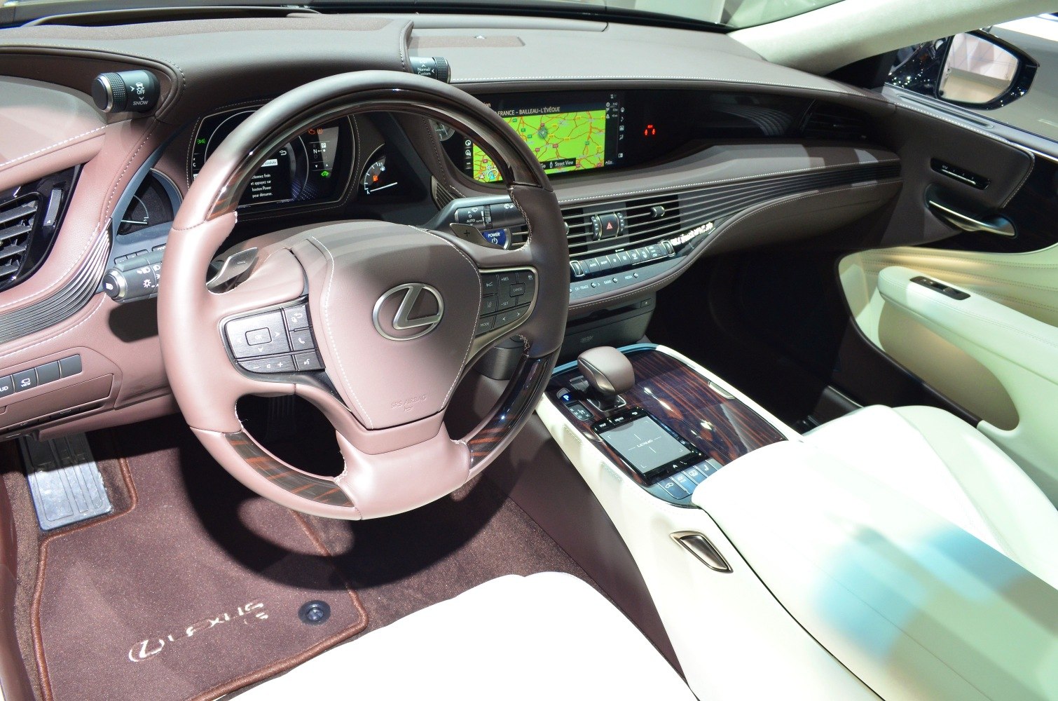 Luxurious car interior with leather, wood trim, and advanced infotainment system