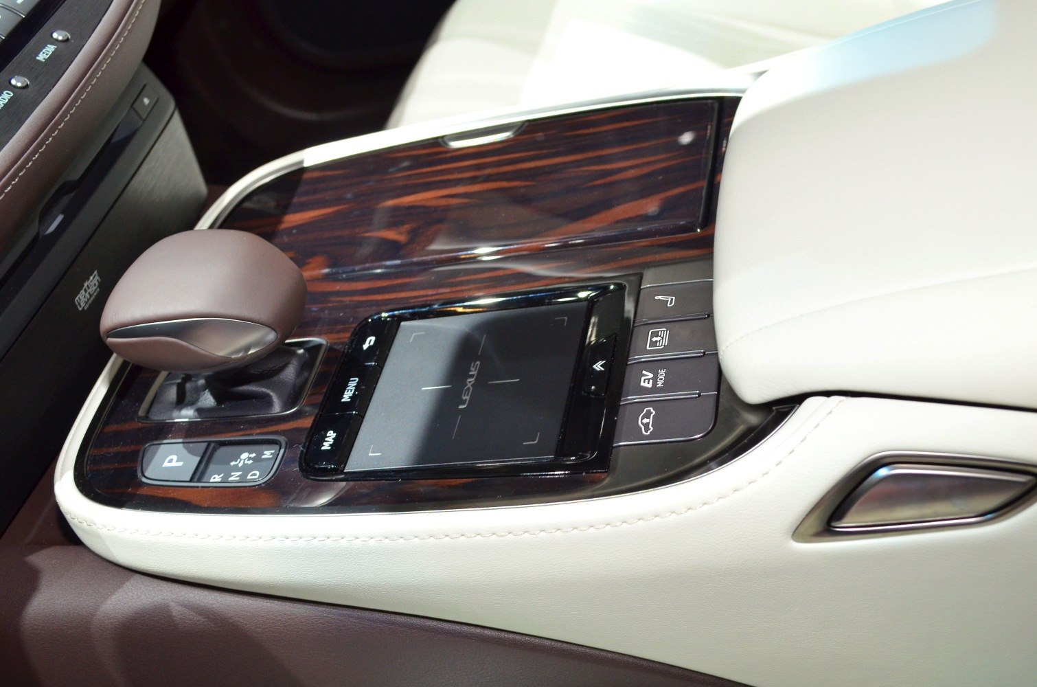 Center console with wood trim, touchpad, gear selector