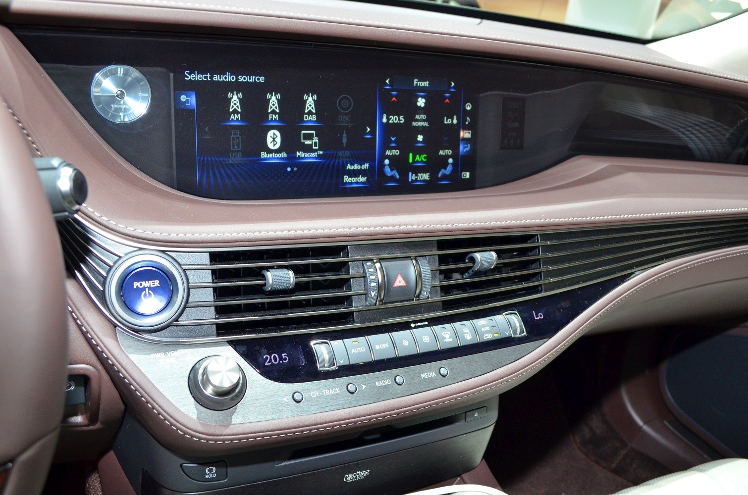 Car interior dashboard with digital infotainment and multi-zone climate control