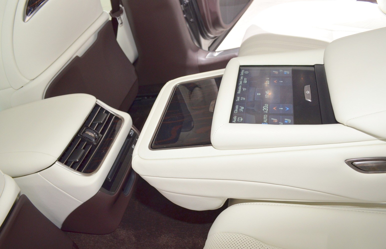 Rear seat touchscreen controller and climate control vents on center console