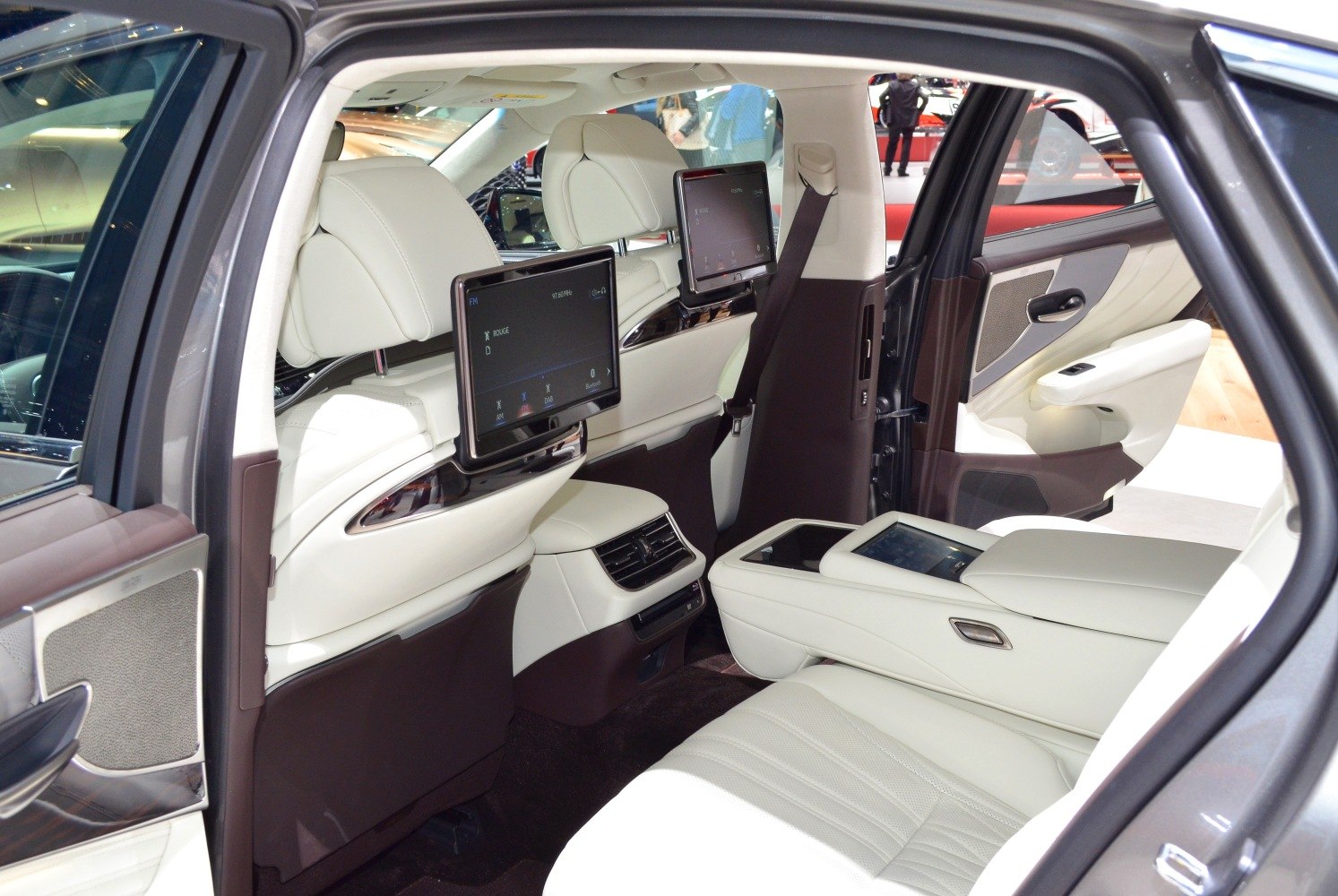 Rear seat entertainment screens and white leather interior with premium trim