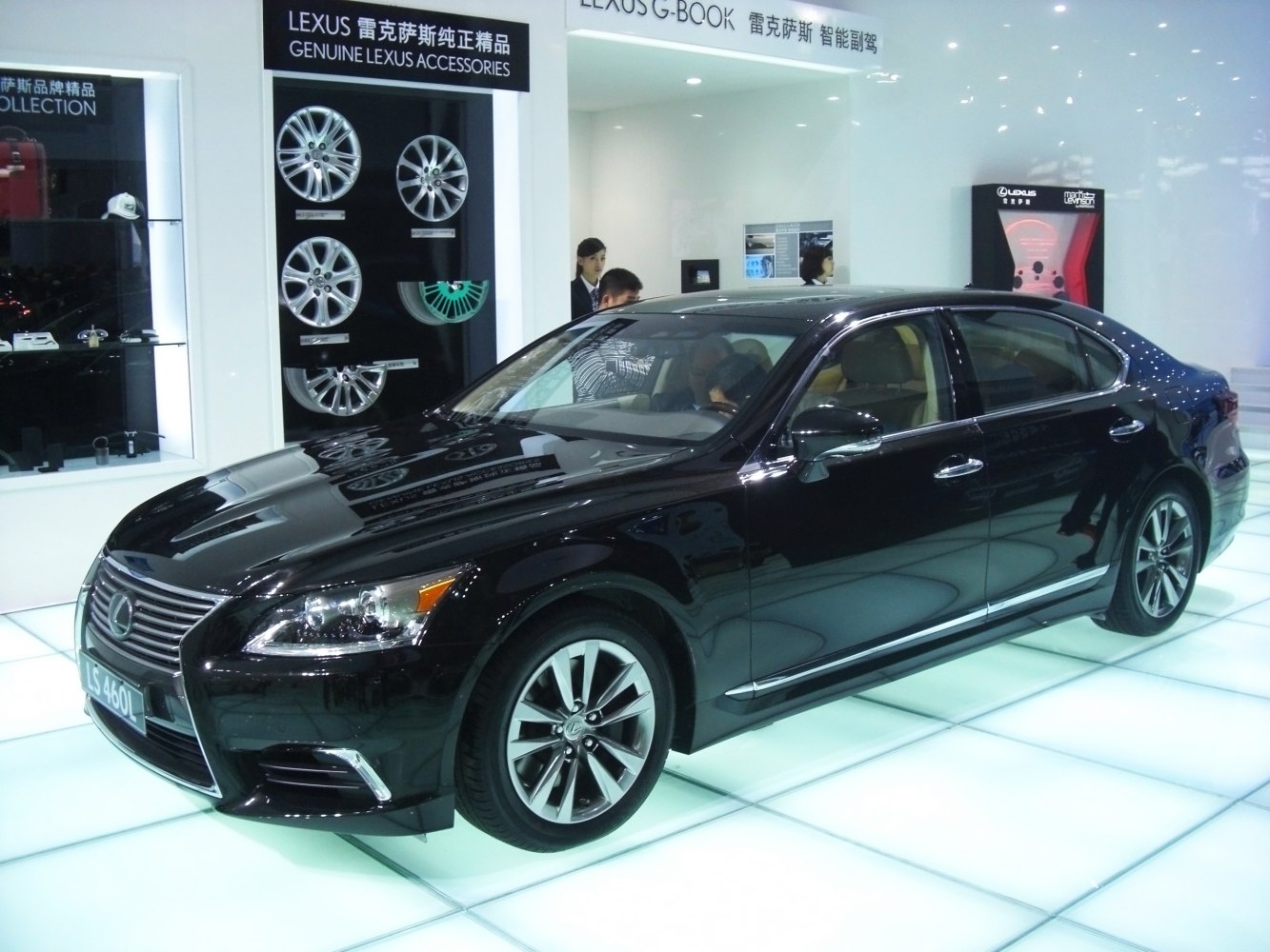 Front side view of luxury sedan with sleek headlights and alloy wheels