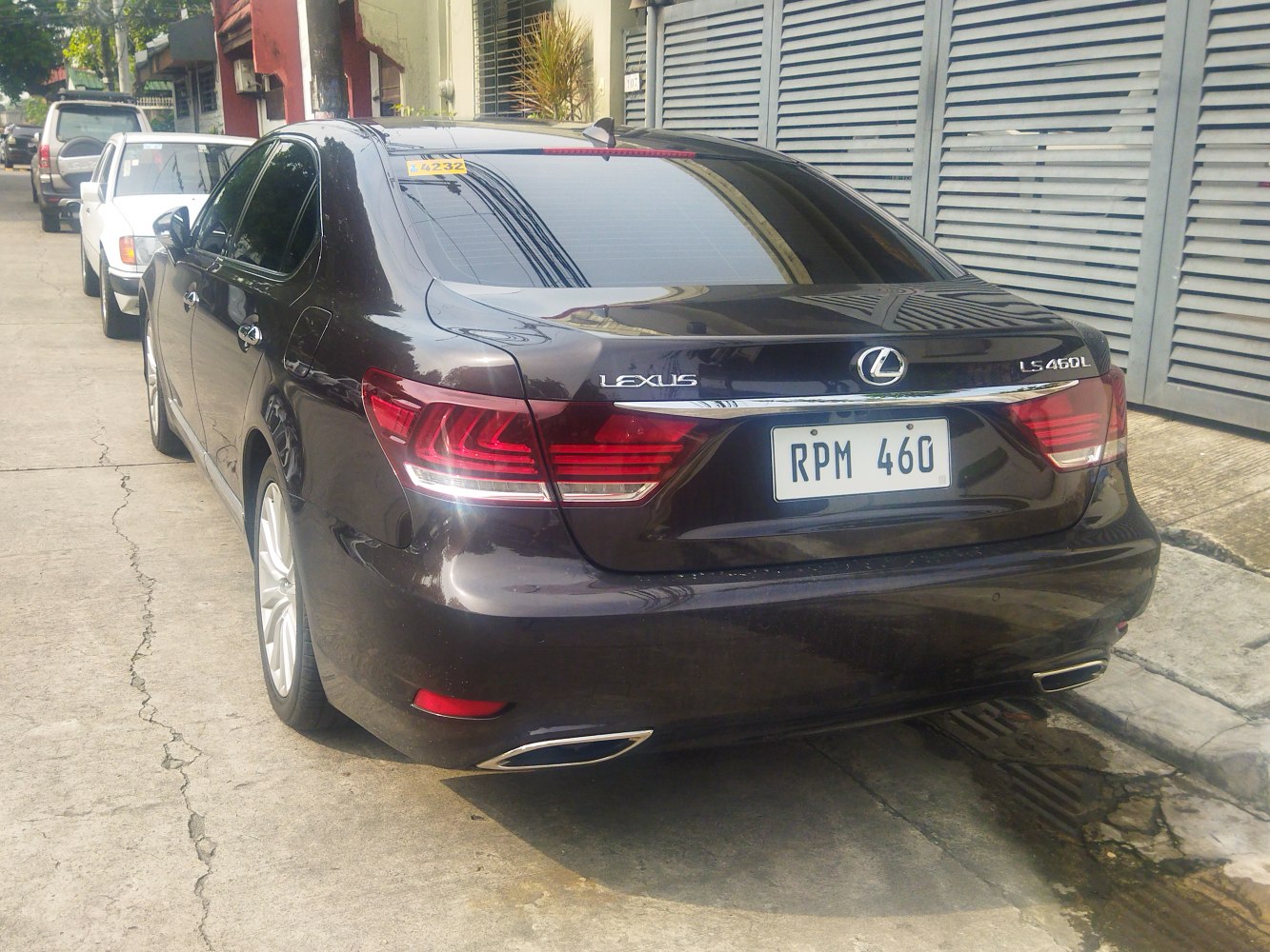 Rear view with taillights and dual exhaust of luxury sedan