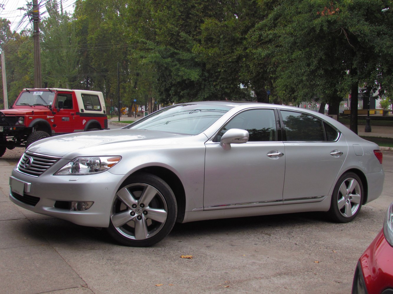 Silver luxury sedan with alloy wheels and sleek side profile