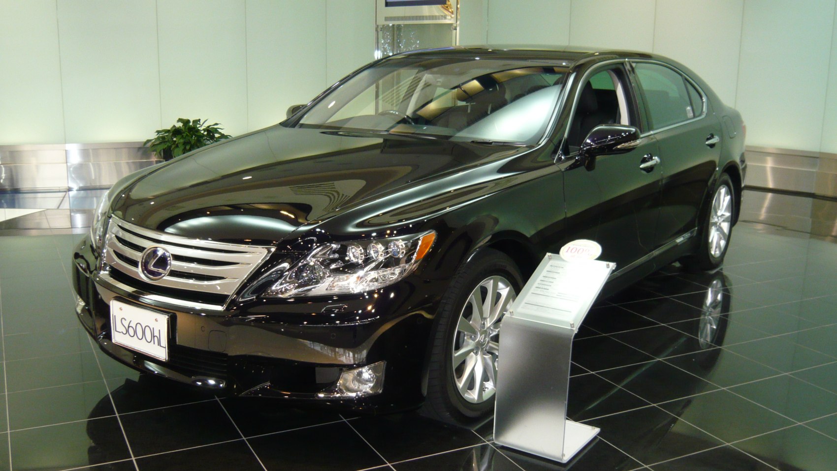 Luxury sedan front view with chrome grille and LED headlights