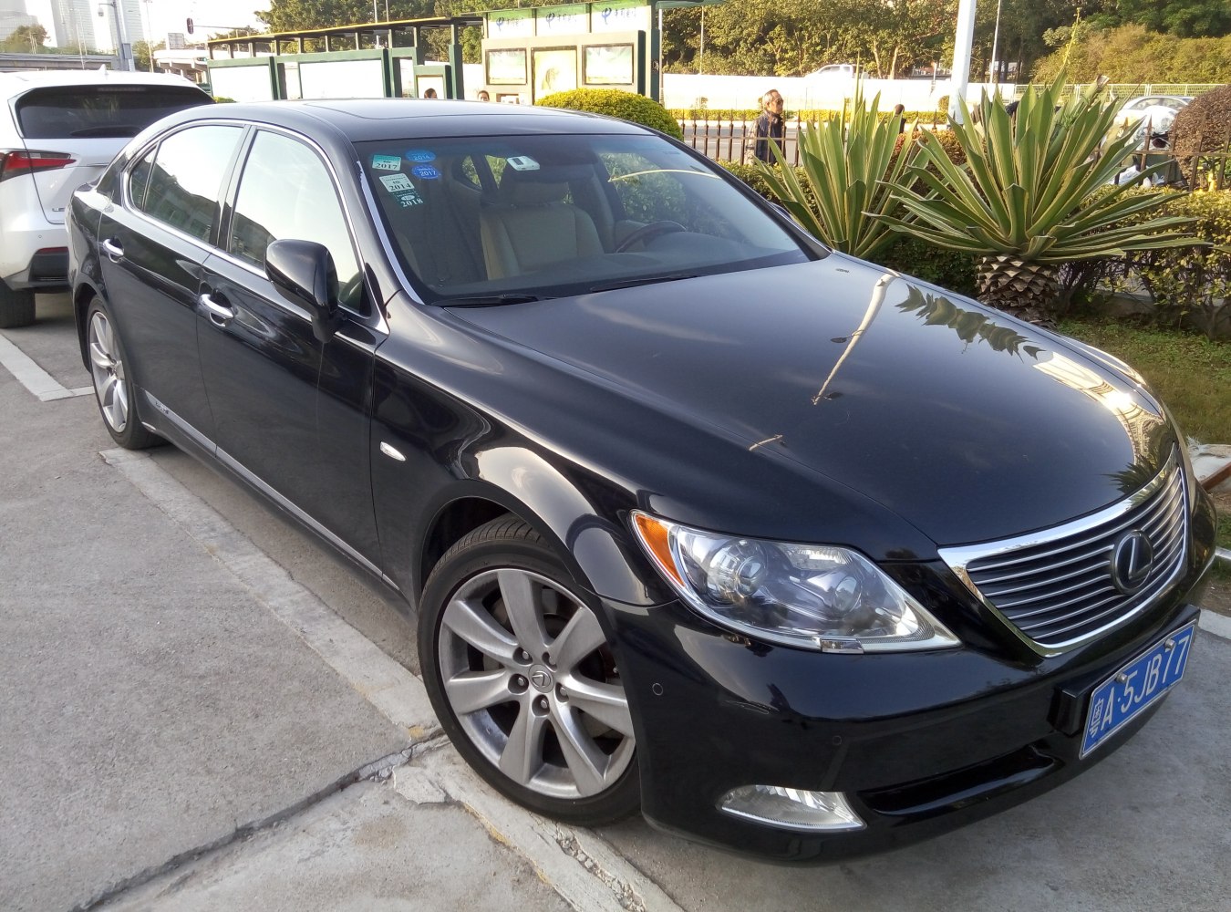 Black luxury sedan with distinctive front grille and headlights