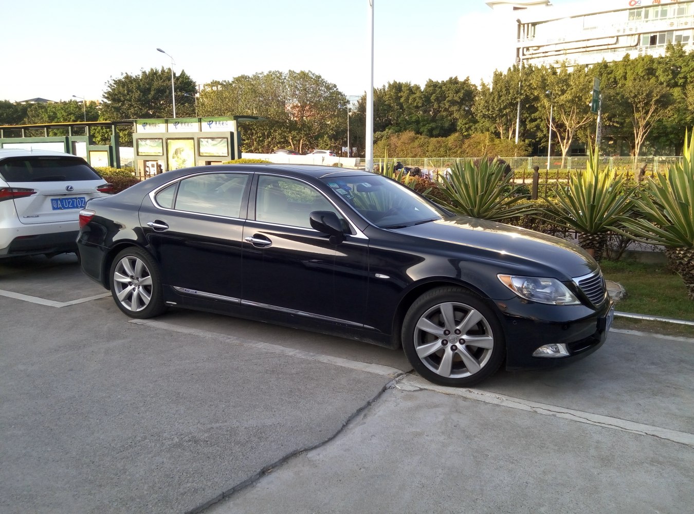 Sleek luxury sedan side view with alloy wheels