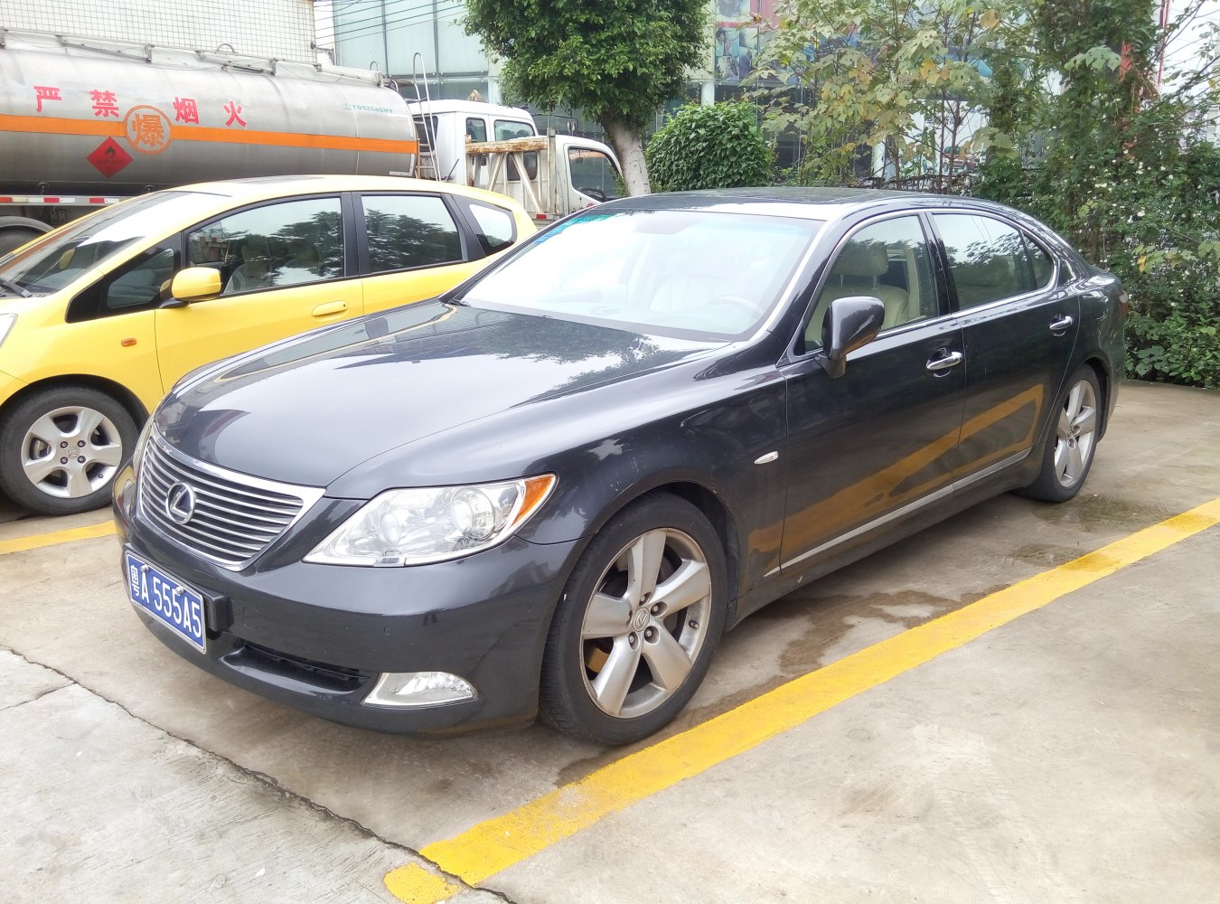 Luxury sedan front side view with alloy wheels and sleek design