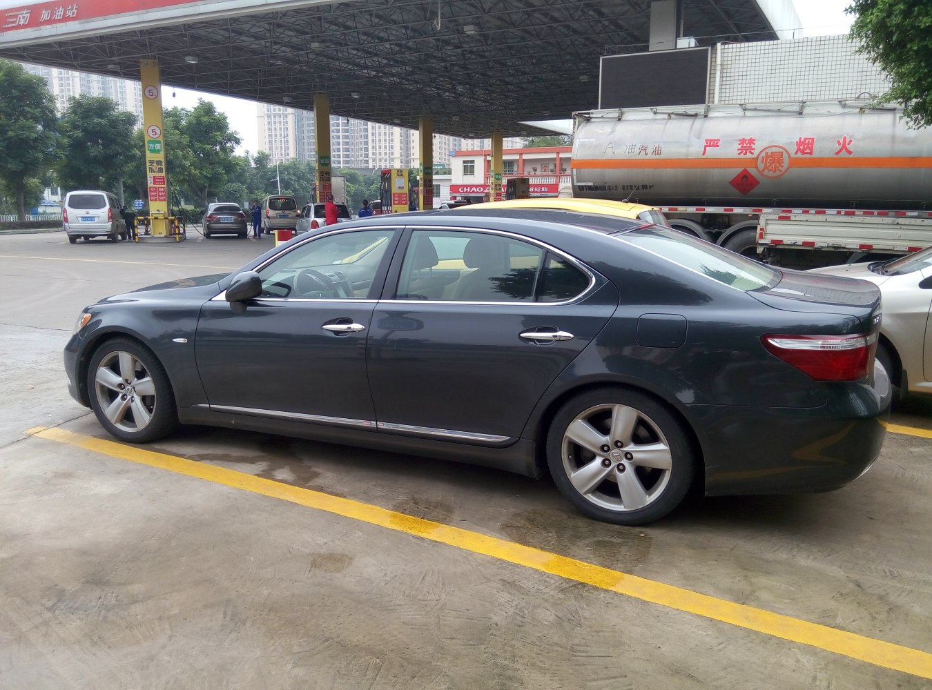 Luxury sedan side profile with chrome accents and alloy wheels