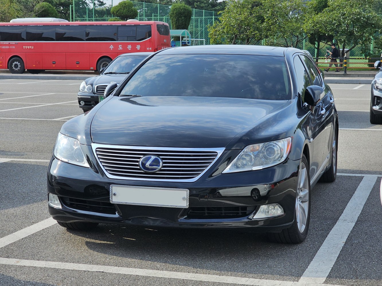 Front view of luxury sedan with distinctive grille and headlights