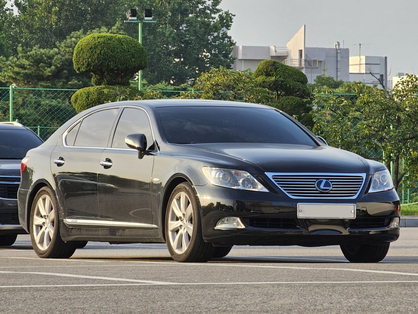 Sleek front-side view of a luxury sedan with distinctive grille and body lines