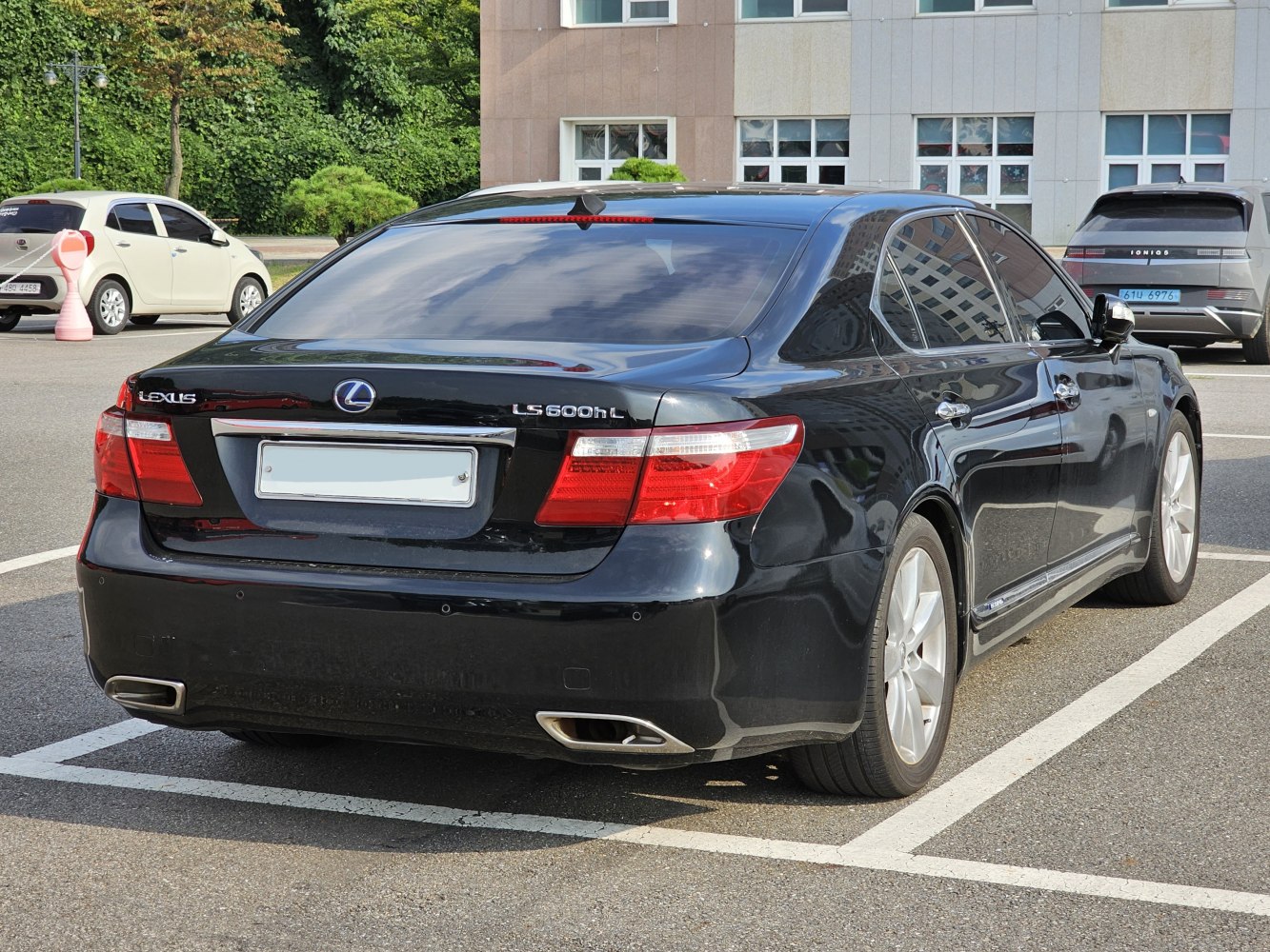 Rear view of luxury sedan with dual exhaust and distinctive tail lights