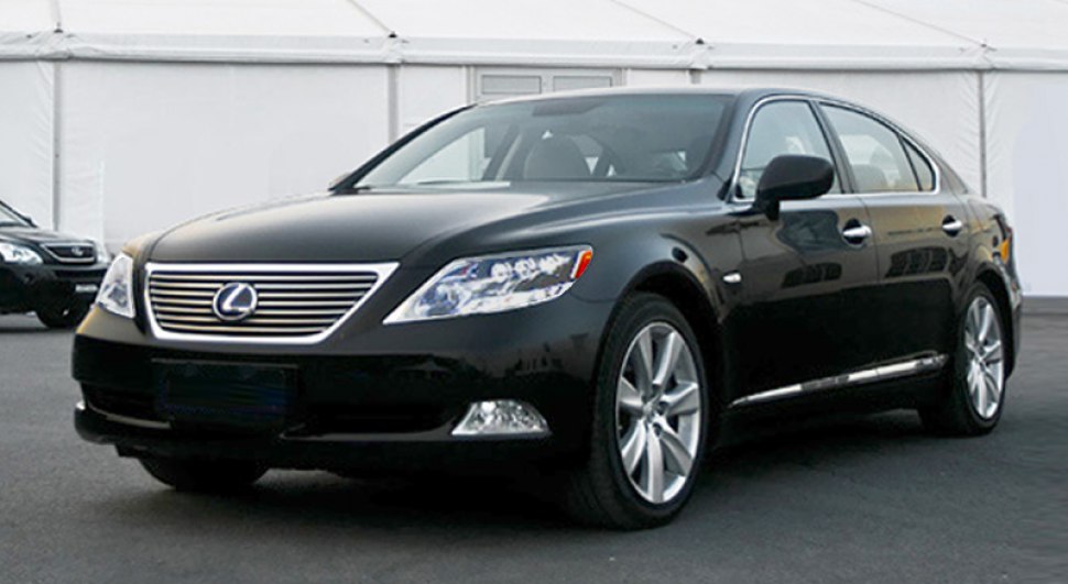 Front-side angle showing grille, headlights, and sleek body of a luxury sedan