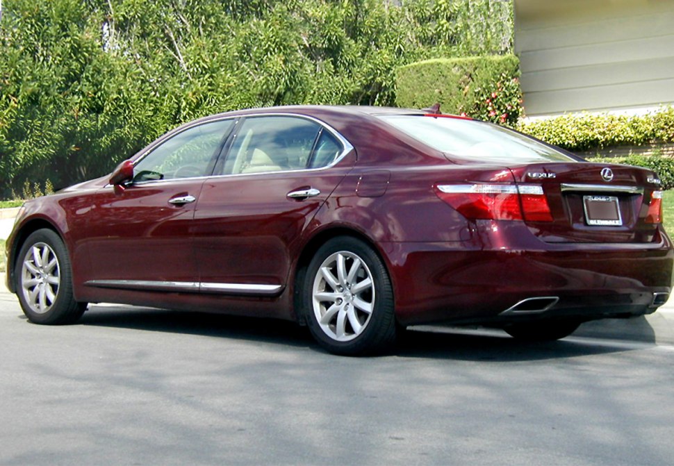 Rear and side view of a luxury sedan with elongated body and chrome accents