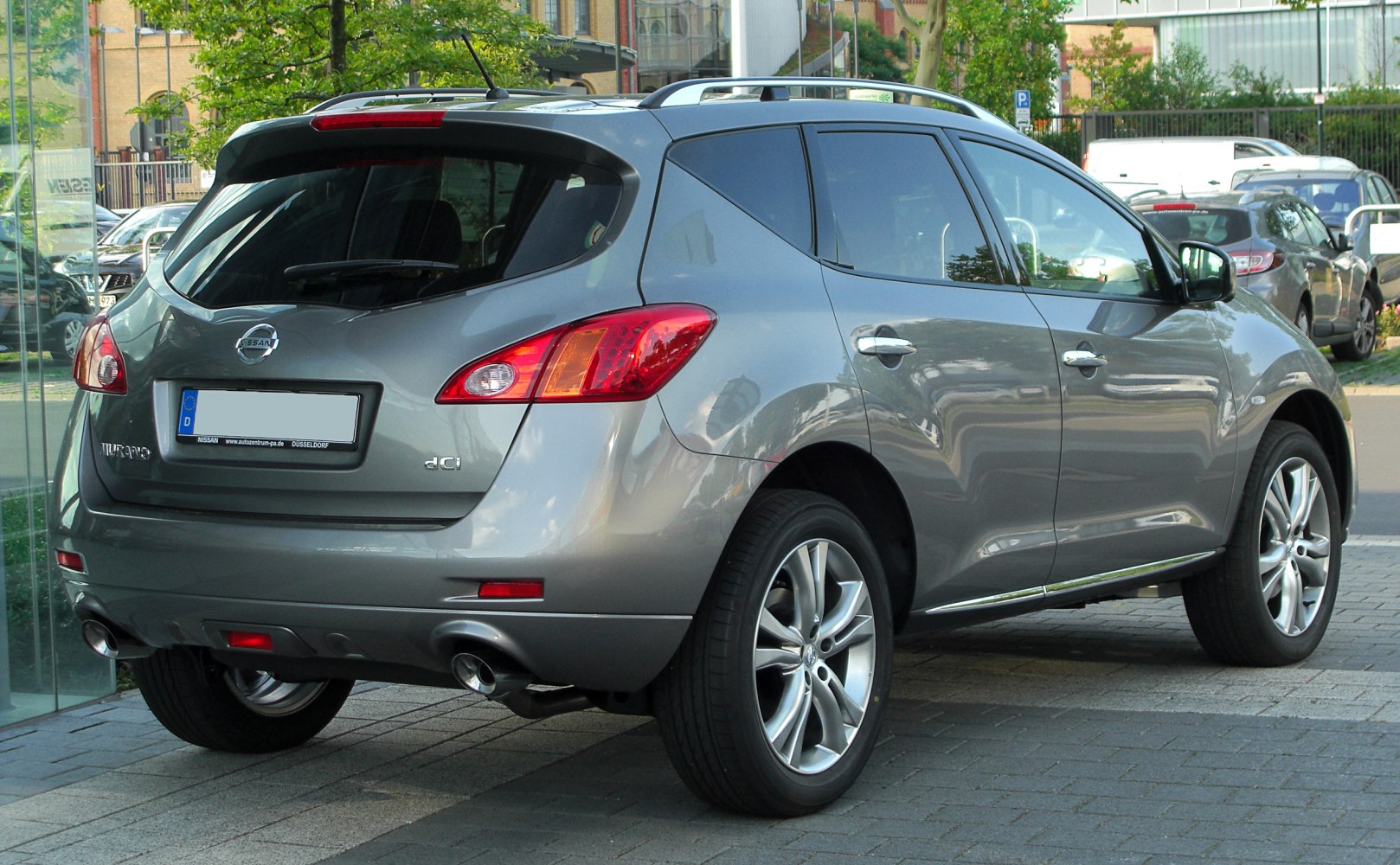 Rear view of SUV with dual exhaust and roof rails