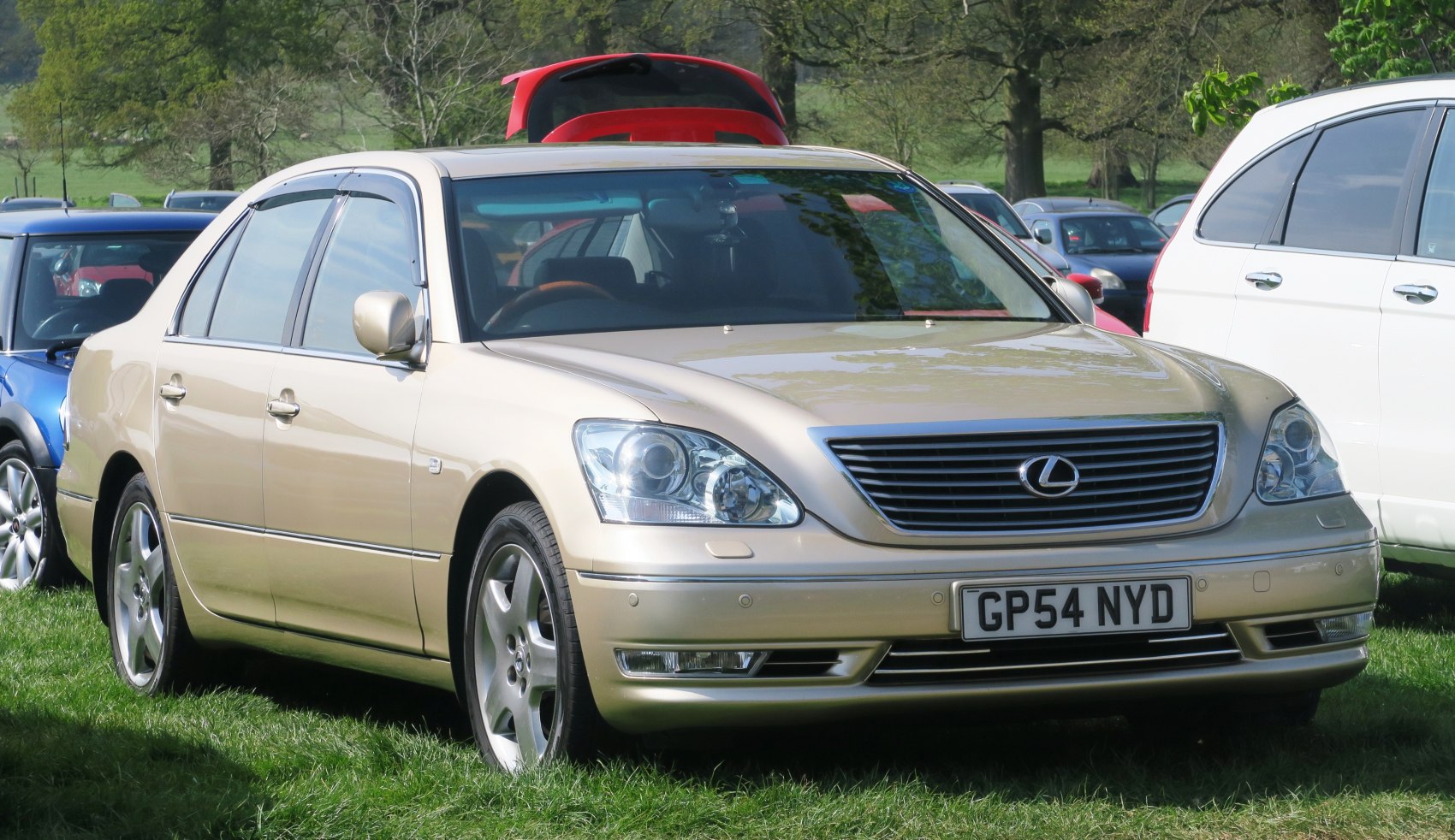 Front view with distinctive headlights and grille of a luxury sedan