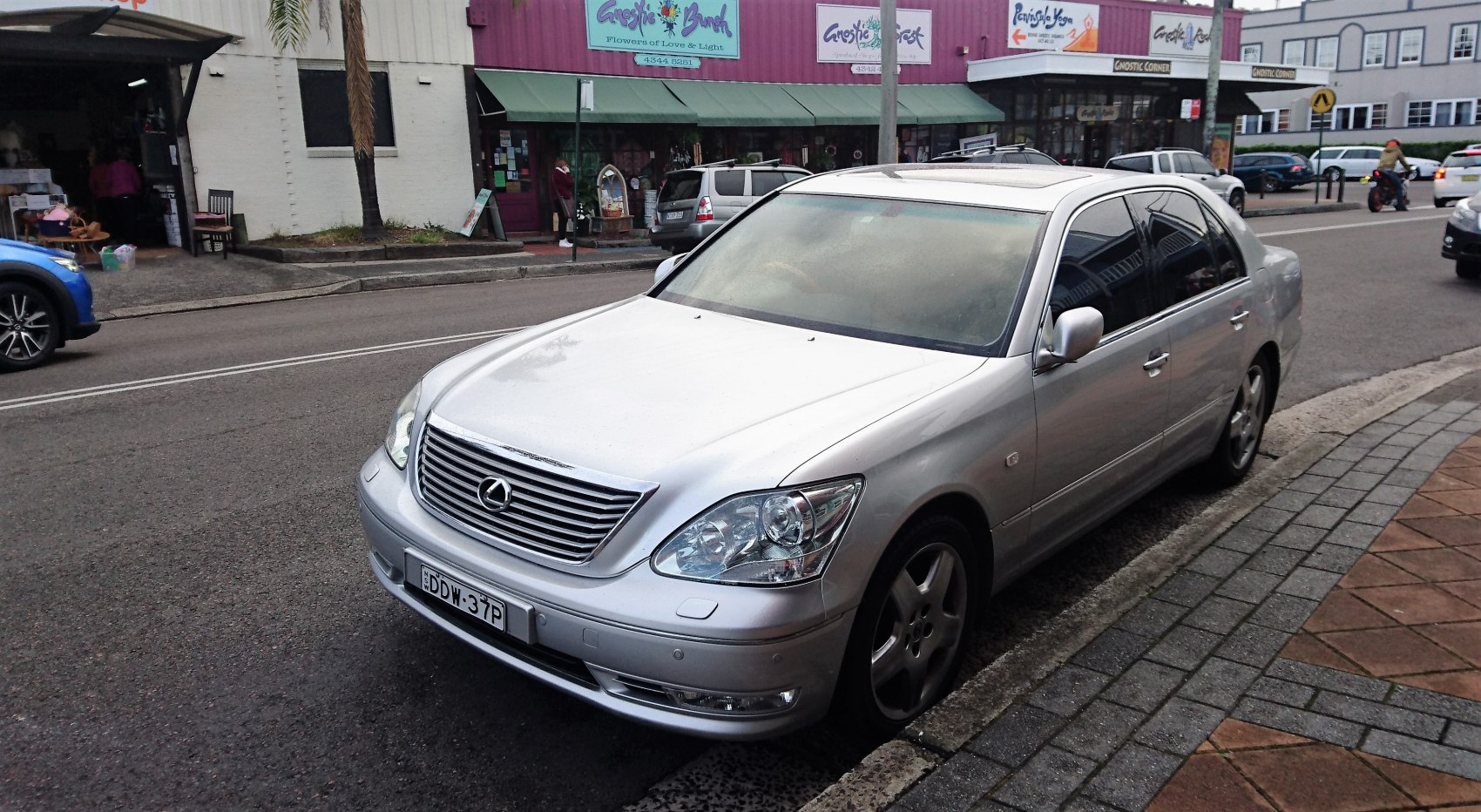 Silver luxury sedan with distinctive grille and sleek body design